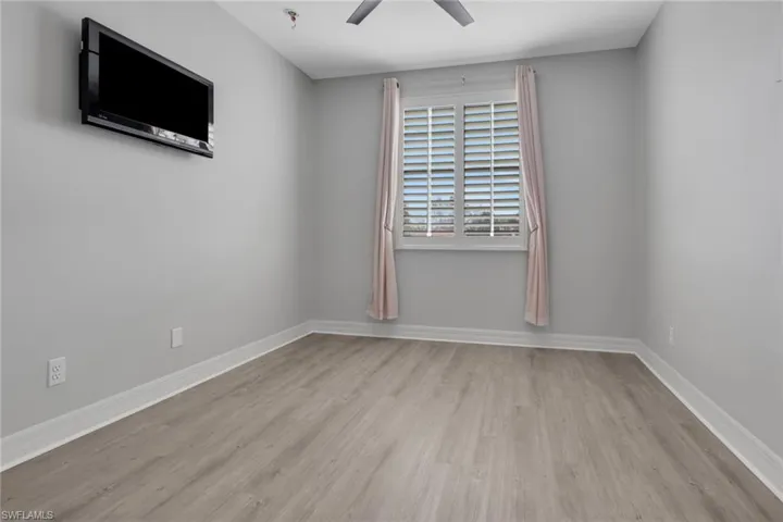 Spare room with light wood-style floors and ceiling fan