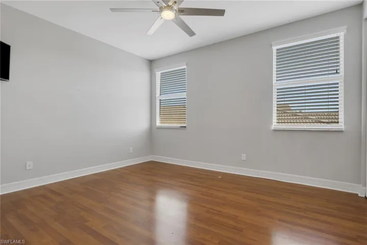 Spare room featuring a ceiling fan and wood finished floors