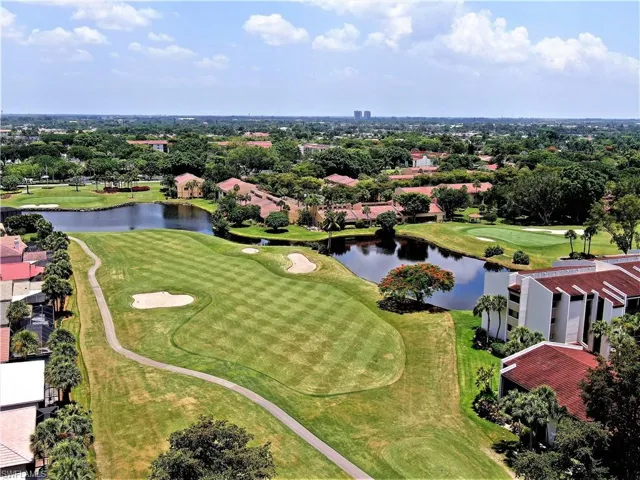 Bird's eye view with a water view, golf course view, and a residential view