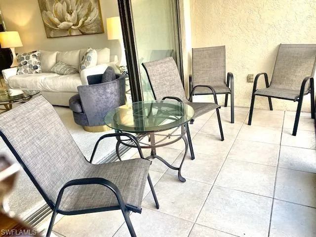 Balcony with a patio area, an outdoor living space, and outdoor dining area