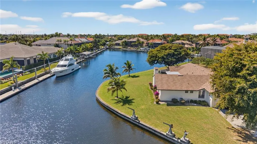 Aerial view of residential area featuring a large body of water