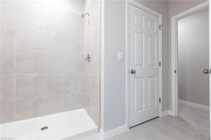 Bathroom featuring a tile shower