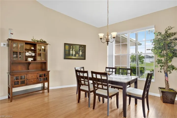 Dining area featuring a chandelier and light wood-style floors