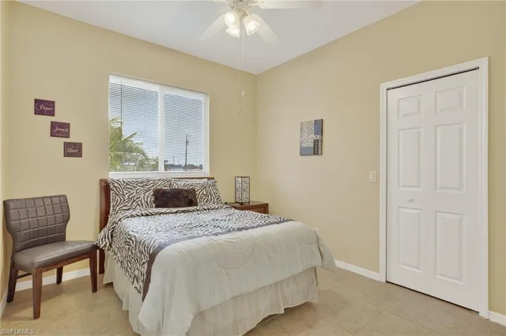 Bedroom featuring ceiling fan and light tile patterned floors
