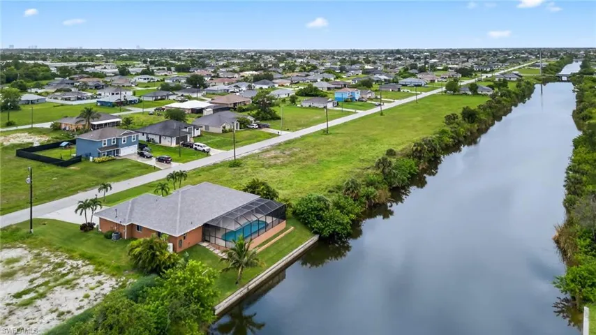 Aerial view of residential area with a nearby body of water
