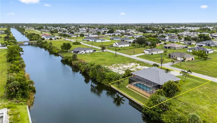 Aerial view of residential area with a nearby body of water