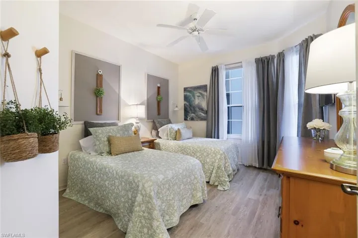 Bedroom featuring hardwood / wood-style flooring and ceiling fan