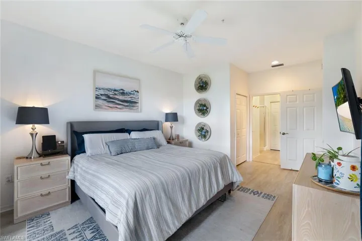 Bedroom with ceiling fan and light hardwood / wood-style floors