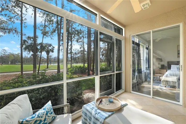 Sunroom featuring ceiling fan