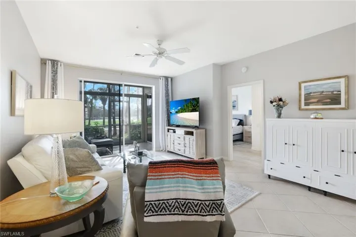 Tiled living room with ceiling fan