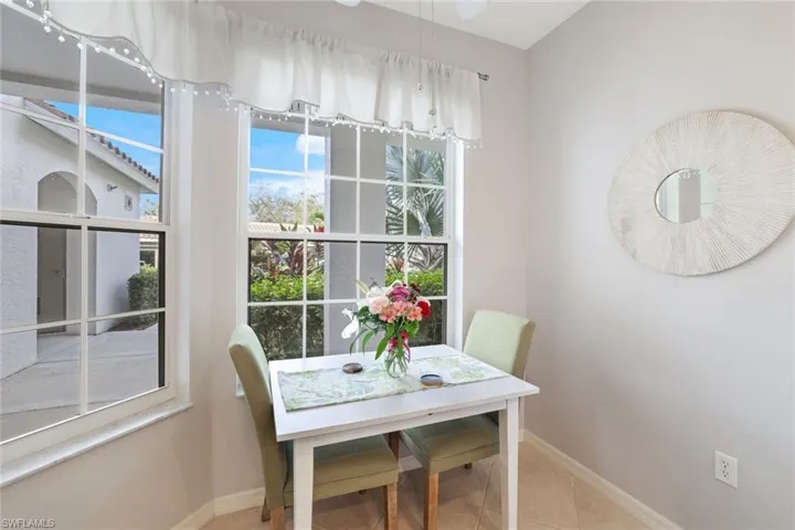 Dining area featuring light tile patterned floors