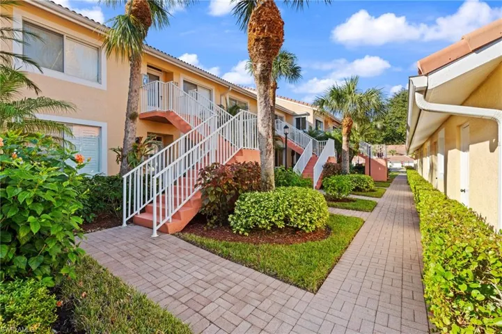 NICELY LANDSCAPED WITH TROPICAL VEGETATION -PAVER WALKWAYS