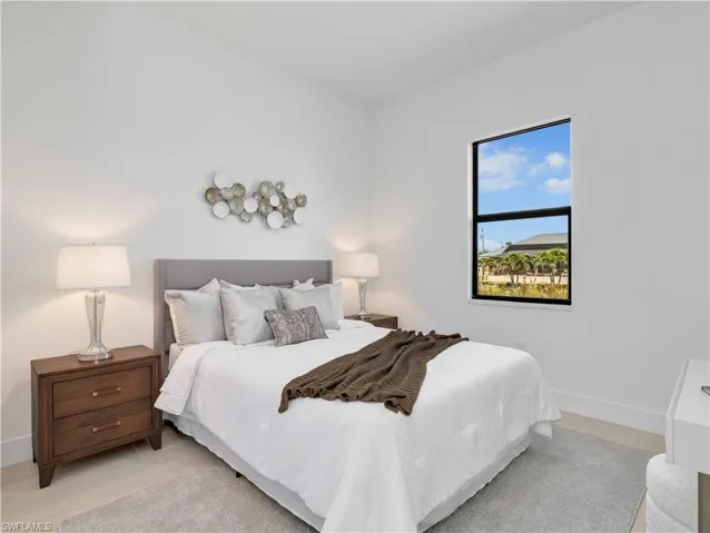 Bright bedroom featuring light wood-finish flooring and a single rectangular window