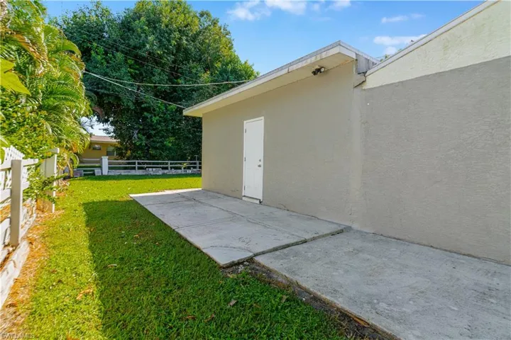 Fenced yard featuring a patio