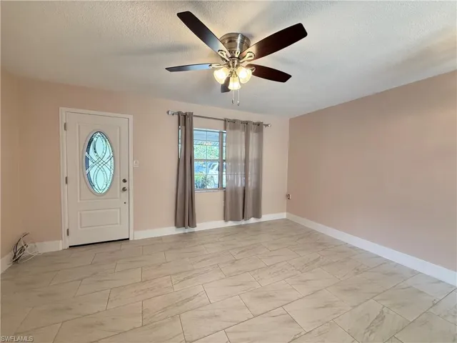 Entrance foyer featuring a textured ceiling