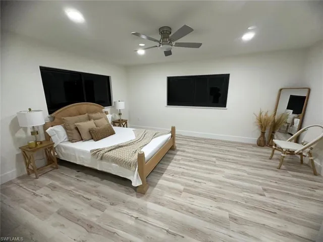 Bedroom featuring recessed lighting, light wood-type flooring, and ceiling fan