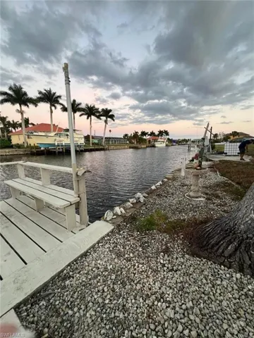 Dock area featuring a water view