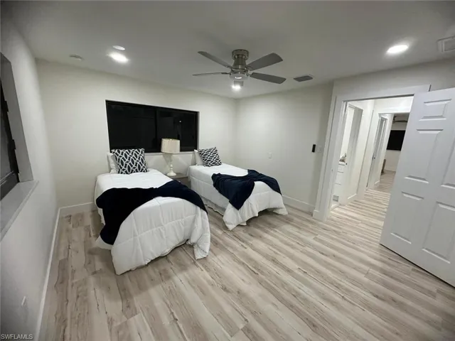 Bedroom featuring recessed lighting, light wood-style floors, and a ceiling fan