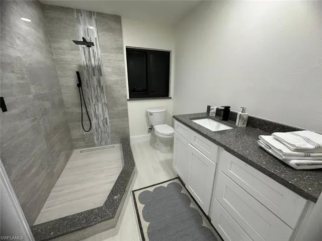Full bath featuring vanity and walk in shower