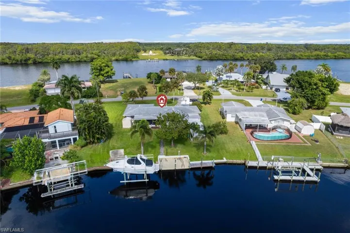 Aerial perspective of suburban area with a nearby body of water