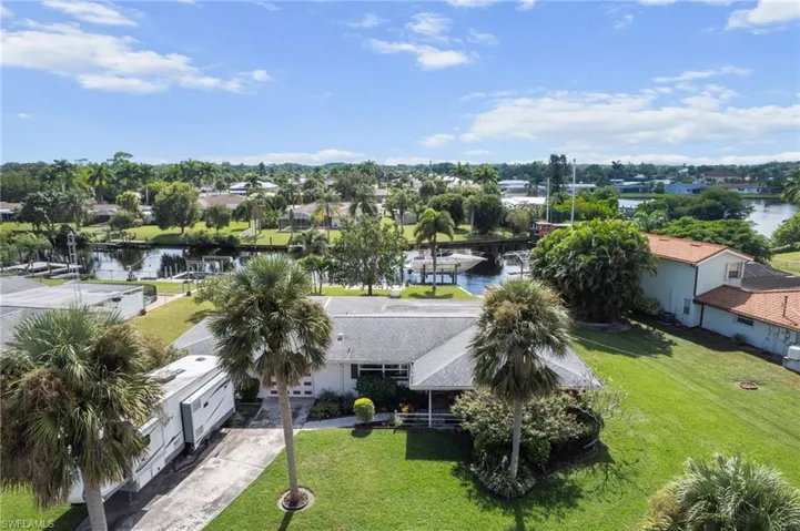 Aerial view of residential area with a nearby body of water