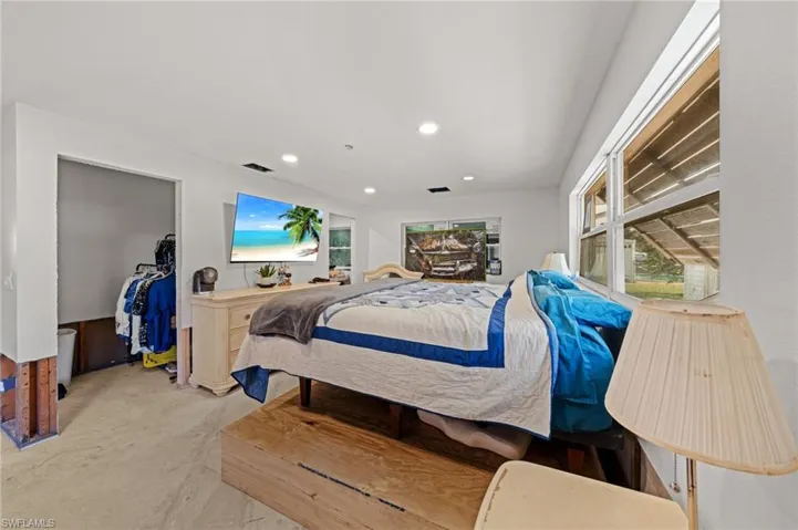 Bedroom featuring recessed lighting and light carpet