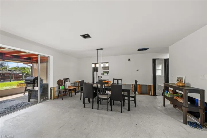 Dining room featuring concrete floors