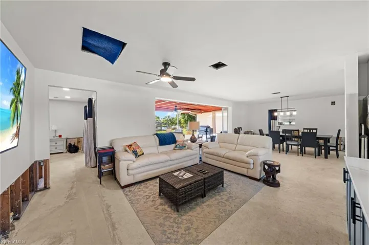 Living area featuring a ceiling fan