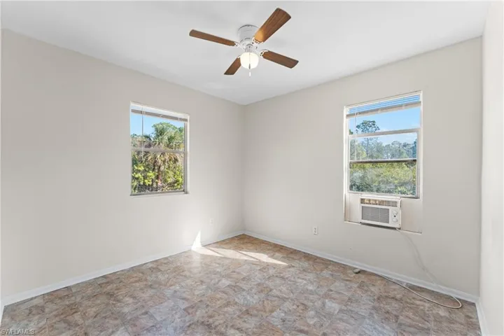 Spare room with cooling unit and ceiling fan