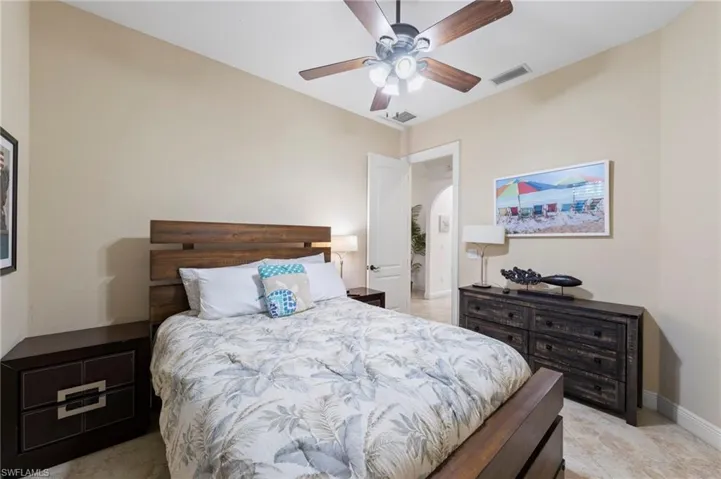 Bedroom featuring a vaulted ceiling with a ceiling fan