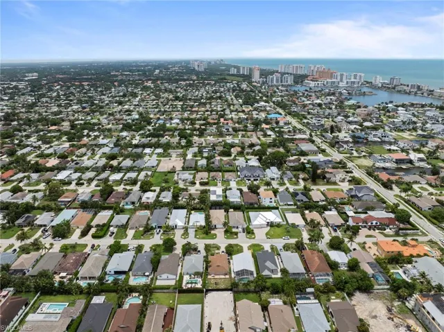 Aerial perspective of a dense residential area featuring numerous single-story homes with varied rooflines