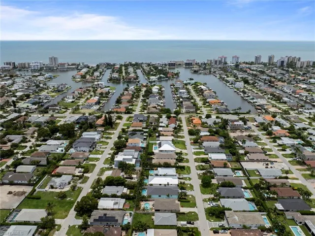 Aerial perspective showcasing a residential area with canal access and multiple private docks