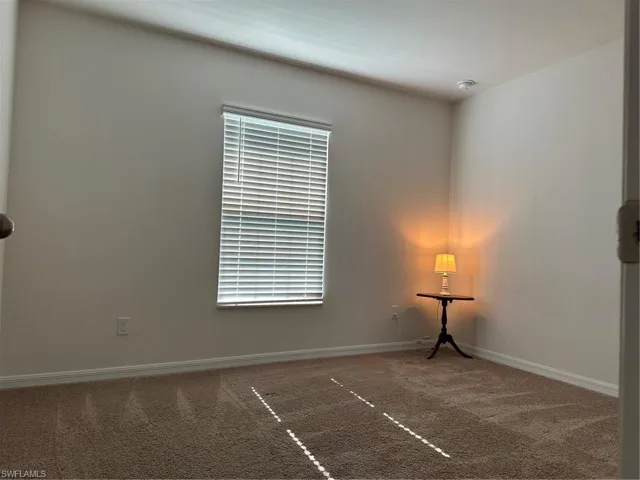 Spare room featuring carpet