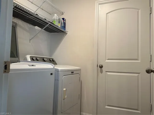 Laundry area featuring separate washer and dryer