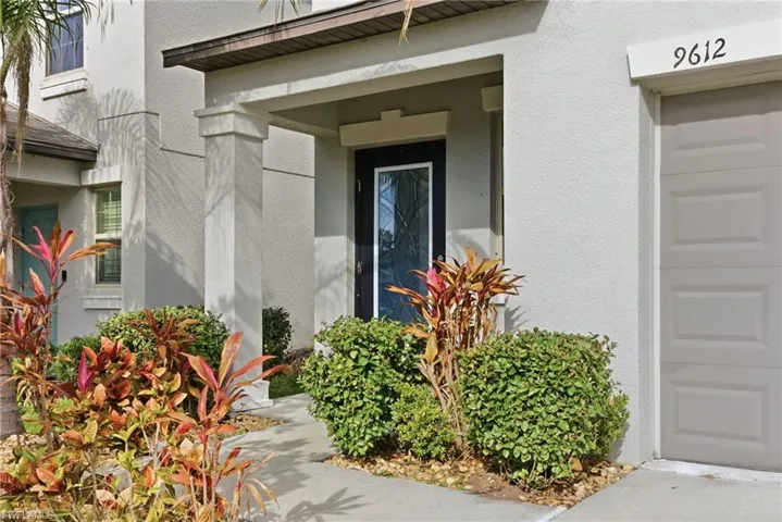 Doorway to property with stucco siding
