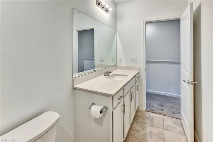 Well-designed full bathroom with a modern vanity, updated fixtures, tile flooring, and a tub-shower combination — clean, bright, and move-in ready.
