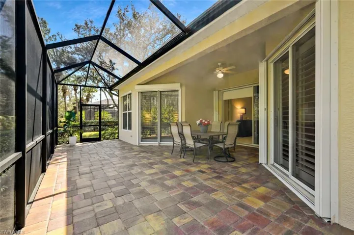 Oversized brick paved lanai with preserve view