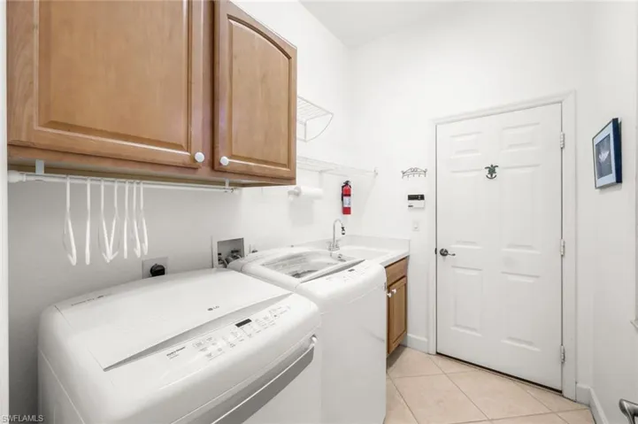 Laundry room with mud sink and additioanl storage