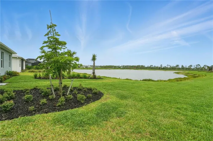 View of green lawn with a water view