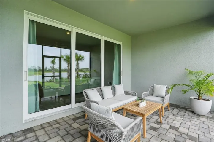 View of patio / terrace featuring a water view and an outdoor hangout area