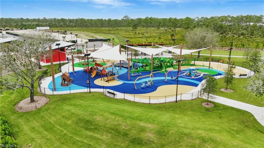 View of play area featuring a lawn