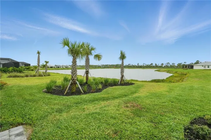 View of grassy yard featuring a water view
