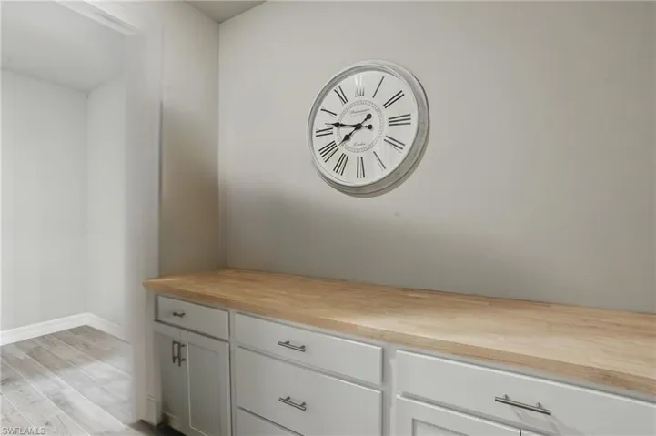 Butcher Block Counter Top & Cabinets in Laundry for Storage