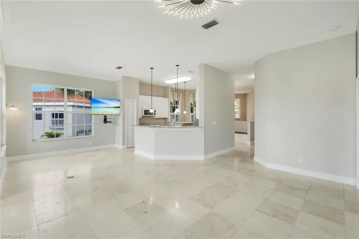 Large living room with attractive travertine flooring