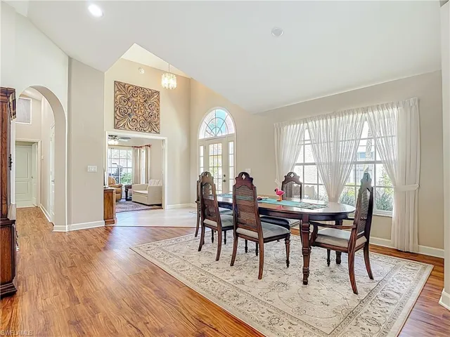Dining room with vaulted ceiling, and laminate  floors