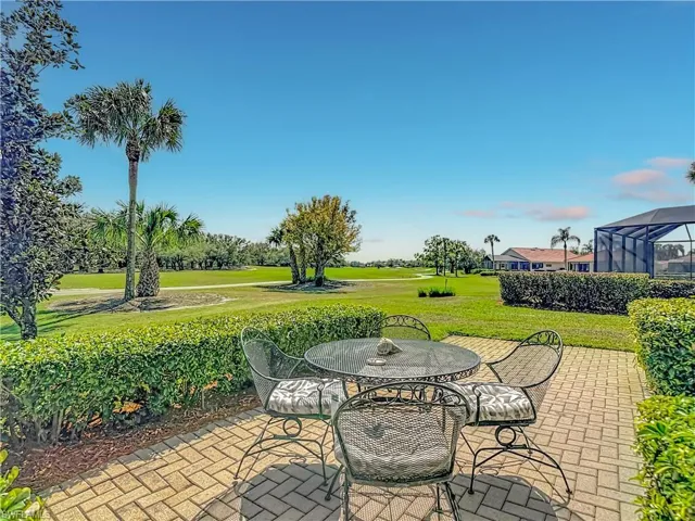 View of patio featuring outdoor dining area and golf course view