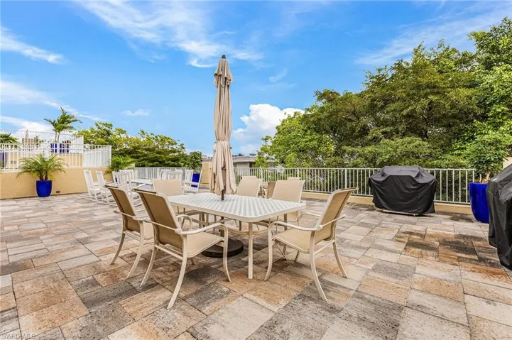 View of patio featuring outdoor dining area and area for grilling
