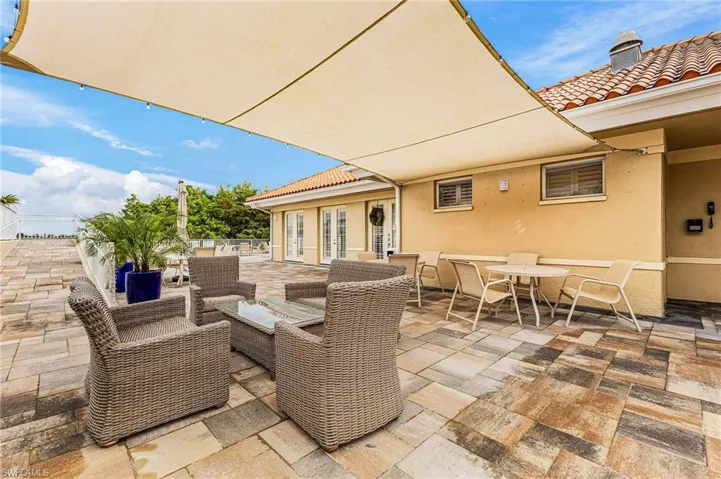View of patio featuring outdoor dining space, french doors, and outdoor lounge area