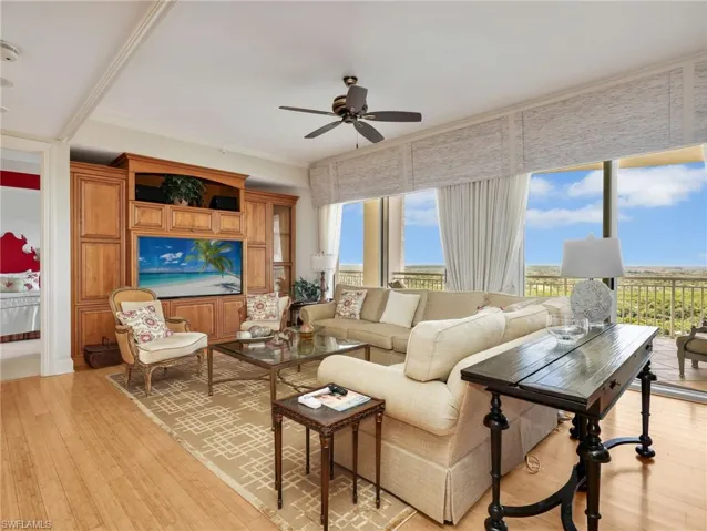 Bright Living Room with Balcony Access and Scenic East Views