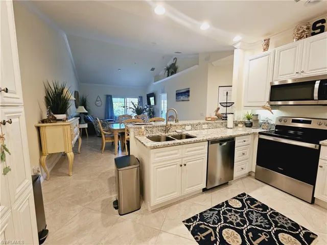 Granite countertops & stainless steel appliances in your well appointed kitchen